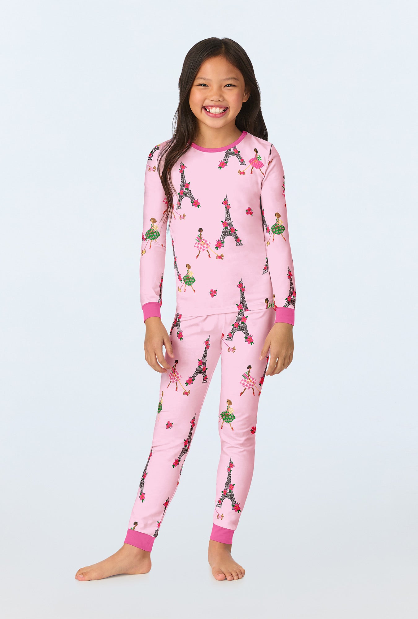 A girl wearing Tres Chic Long Sleeve Stretch Jersey Kids PJ Set