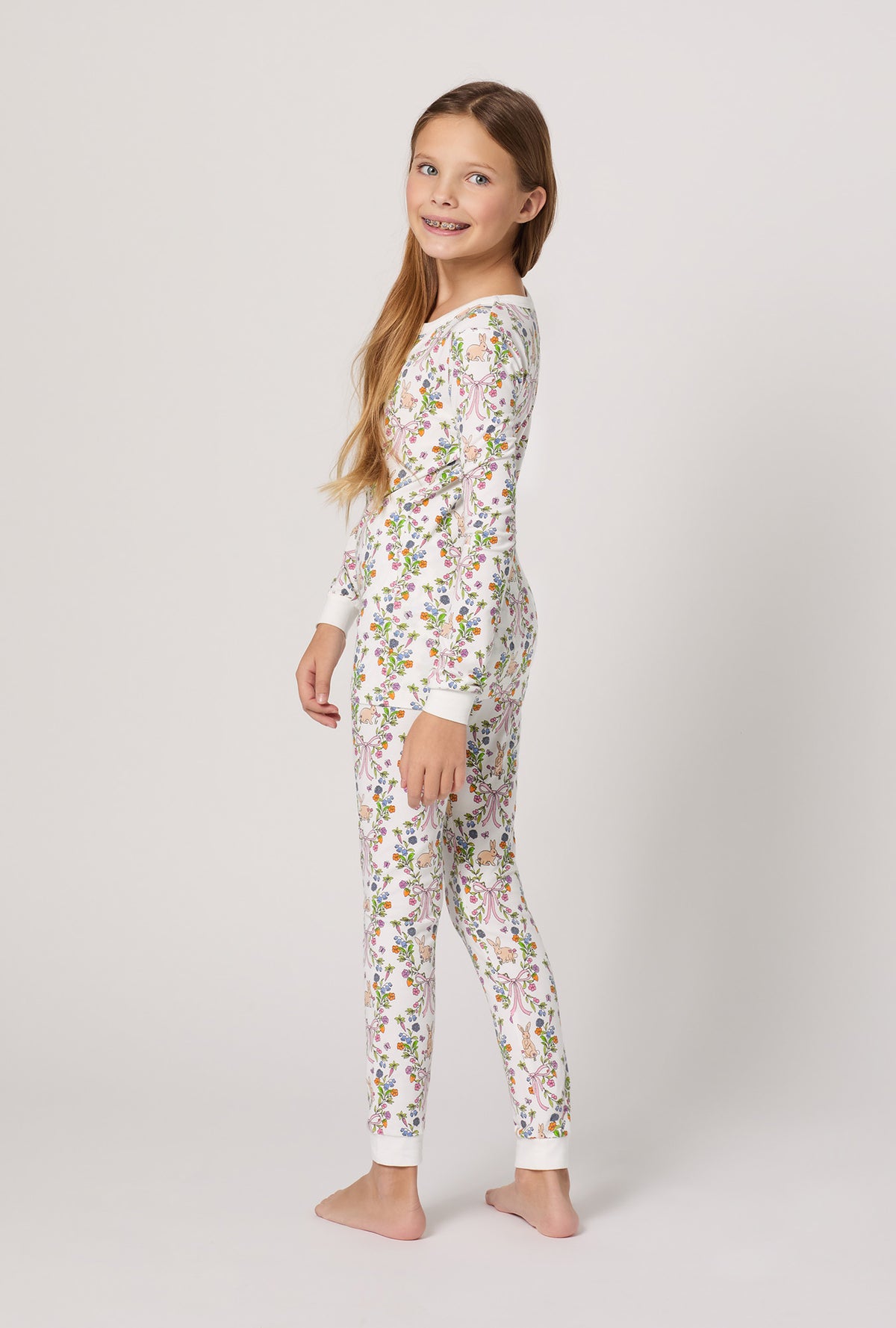 A girl wearing Bunny Blooms Long Sleeve Stretch Jersey Kids Pj Set