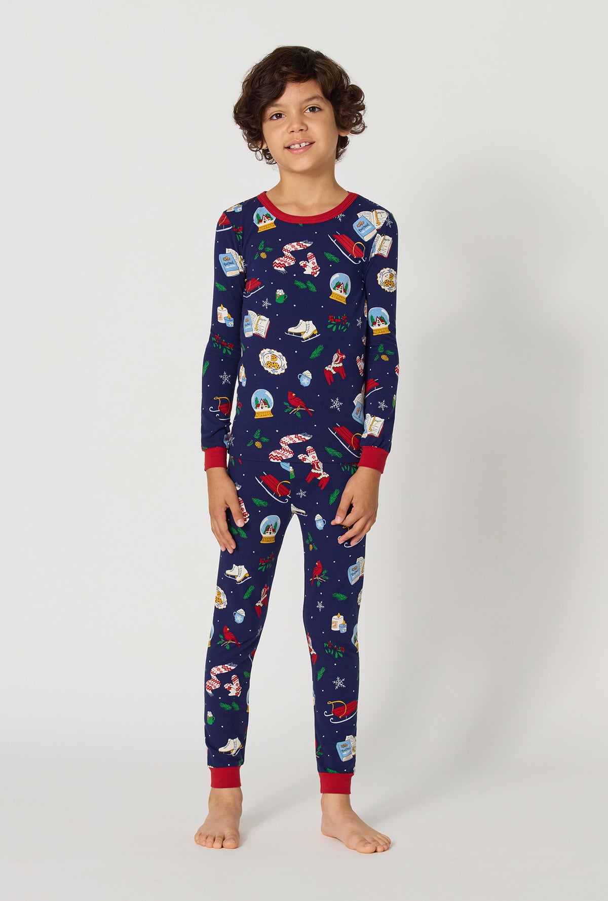 A boy wearing Nordic Nights Long Sleeve Stretch Jersey Kids Pj Set