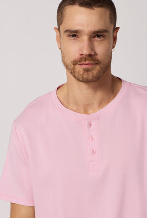 A closeup of A man wearing Green and  Pink Men's Short Sleeve Henley Stretch Jersey Short Pj Set