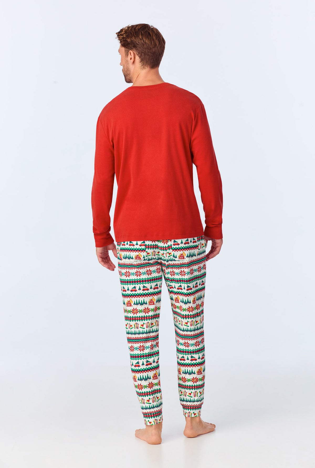 A man wearing Festive Fairisle Men&#39;s Long Sleeve Henley and Jogger Stretch Jersey PJ Set