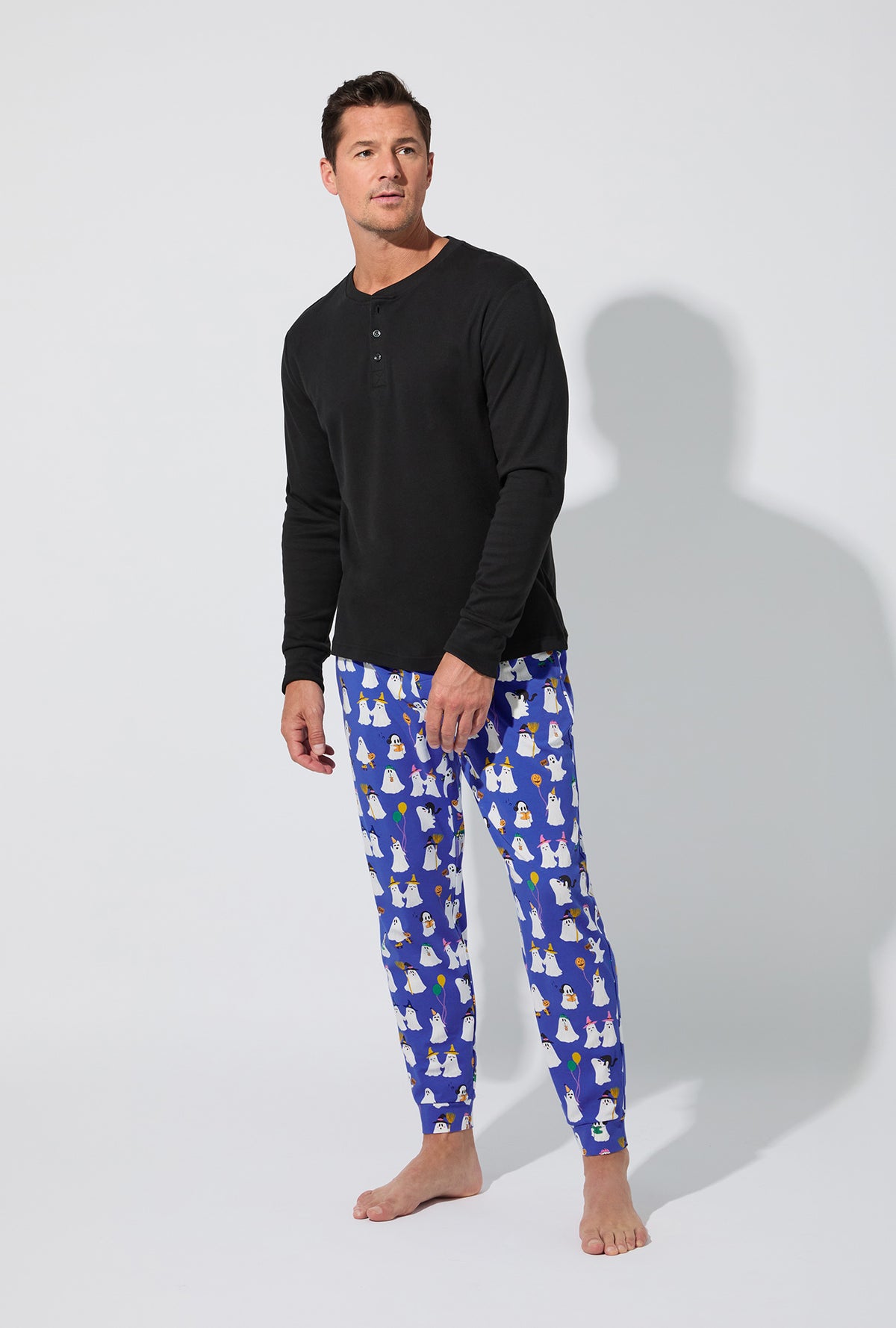 A man wearing That&#39;s The Spirit Men&#39;s Long Sleeve Henley and Jogger Stretch Jersey PJ Set