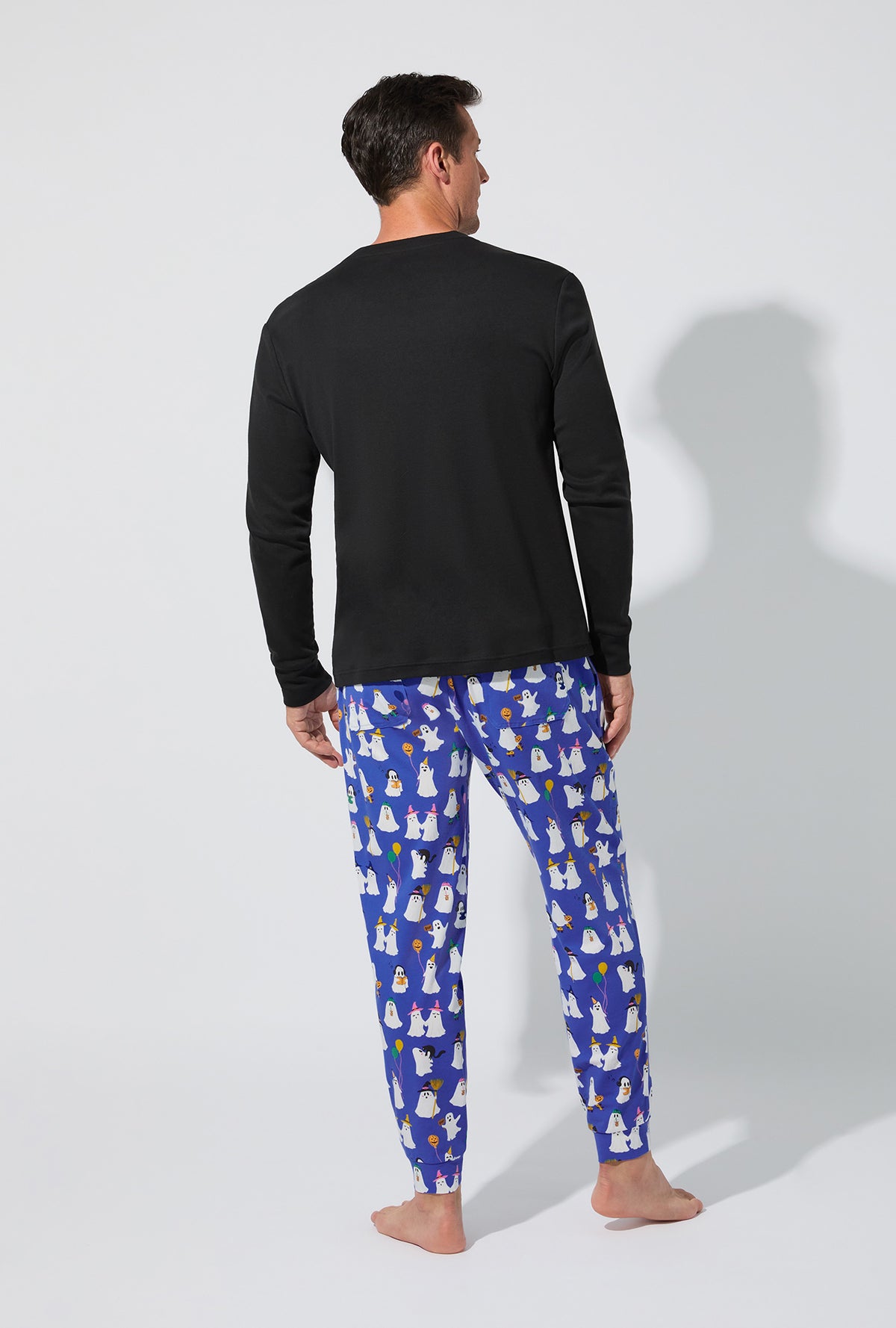 A man wearing That&#39;s The Spirit Men&#39;s Long Sleeve Henley and Jogger Stretch Jersey PJ Set