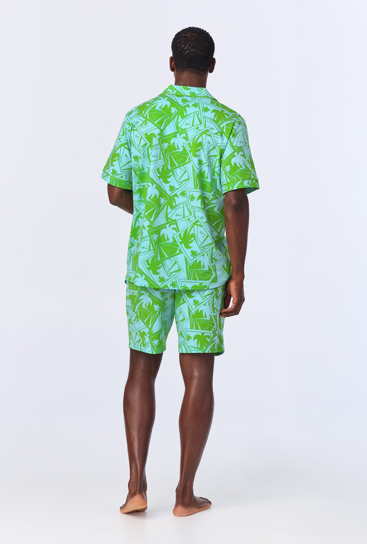 A man wearing BedHead x Mr. Turk Blue Tennis Court Men&#39;s Short Sleeve Notch Stretch Jersey Short PJ Set