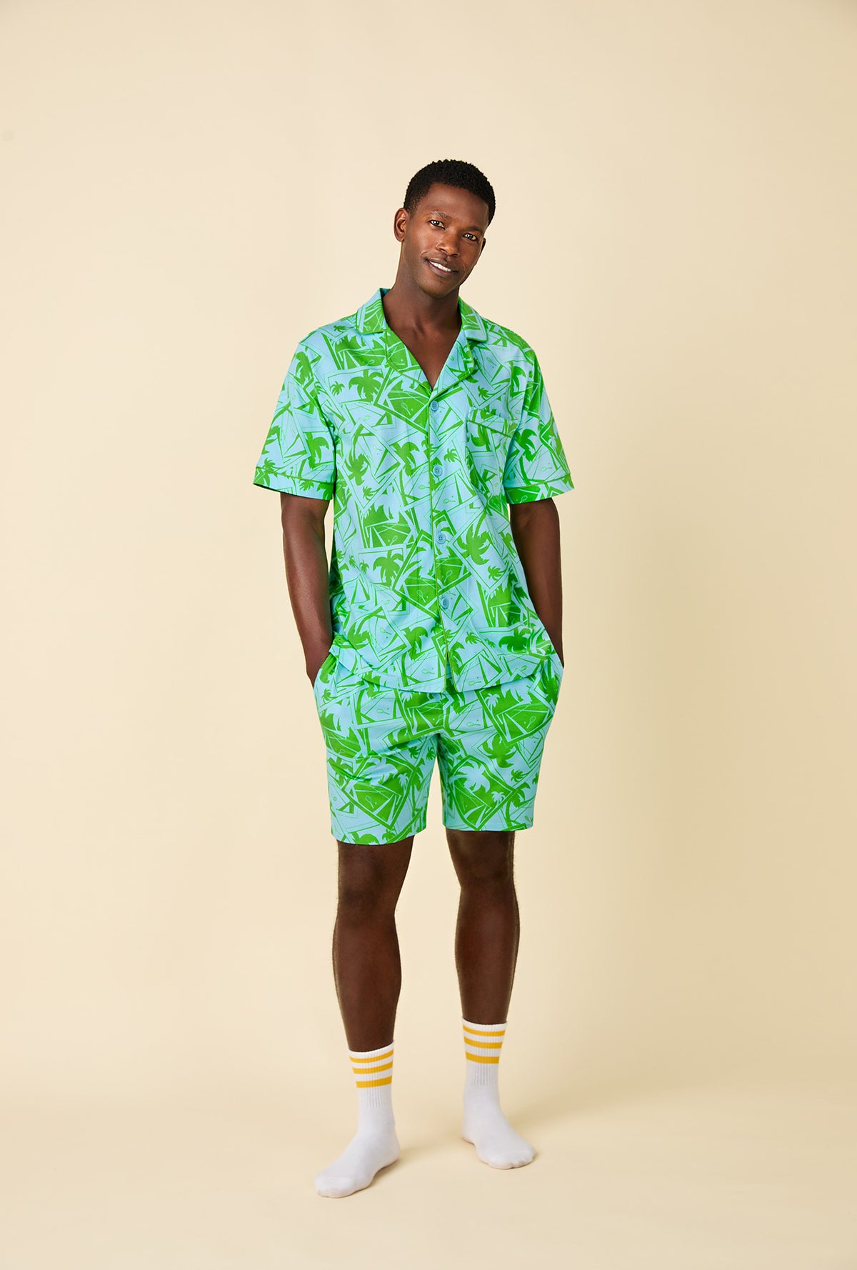 A man wearing BedHead x Mr. Turk Blue Tennis Court Men&#39;s Short Sleeve Notch Stretch Jersey Short PJ Set