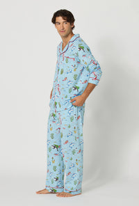 A man wearing Jingle All The Wave Men's Long Sleeve Classic Stretch Jersey Pj Set looking side