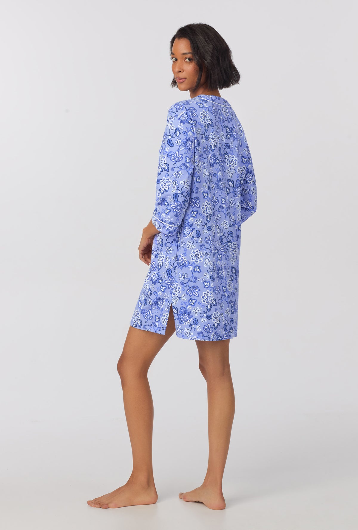 A lady wearing blue 3/4 sleeve stretch jersey sleepshirt with blue dessert flower print