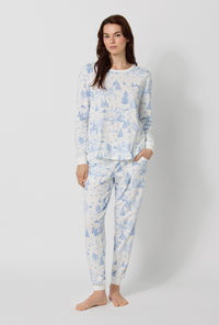 A lady wearing Winter Wonderland Long Sleeve Pullover Crew And Jogger Stretch Jersey Pj Set