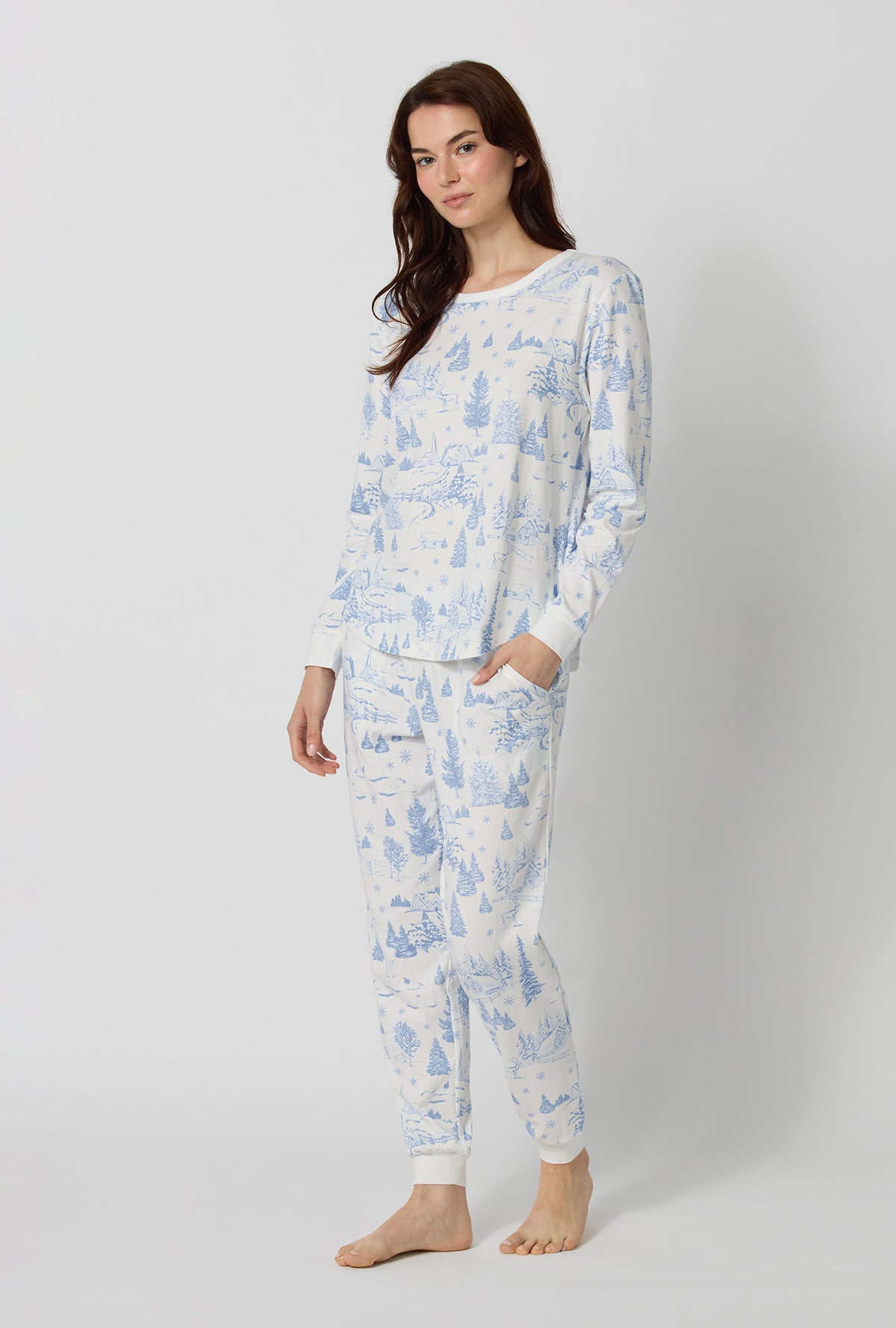 A lady wearing Winter Wonderland Long Sleeve Pullover Crew And Jogger Stretch Jersey Pj Set lookind side