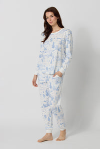 A lady wearing Winter Wonderland Long Sleeve Pullover Crew And Jogger Stretch Jersey Pj Set lookind side