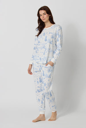 A lady wearing Winter Wonderland Long Sleeve Pullover Crew And Jogger Stretch Jersey Pj Set lookind side