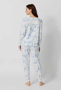 A lady wearing Winter Wonderland Long Sleeve Pullover Crew And Jogger Stretch Jersey Pj Set back view