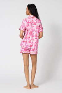 A Lady Wearing Cake Shop Short Sleeve Classic Shorty Stretch Jersey Pj Set turned back while looking to the side