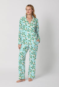 A Lady Wearing Blue Long Sleeve Classic Stretch Jersey PJ Set with Belle Blossoms Print Front View