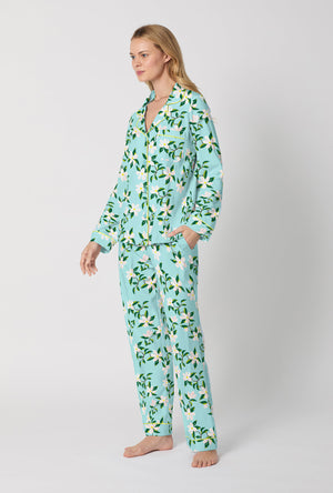 A Lady Wearing Blue Long Sleeve Classic Stretch Jersey PJ Set with Belle Blossoms Print Side Angle View