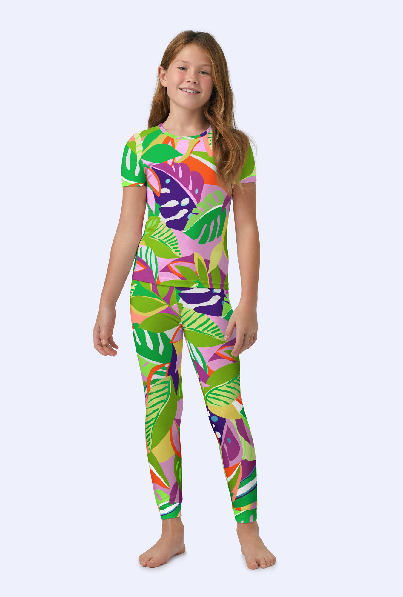 A girl wearing  Jungle Leaves Short Sleeve Stretch Jersey Kids PJ Set