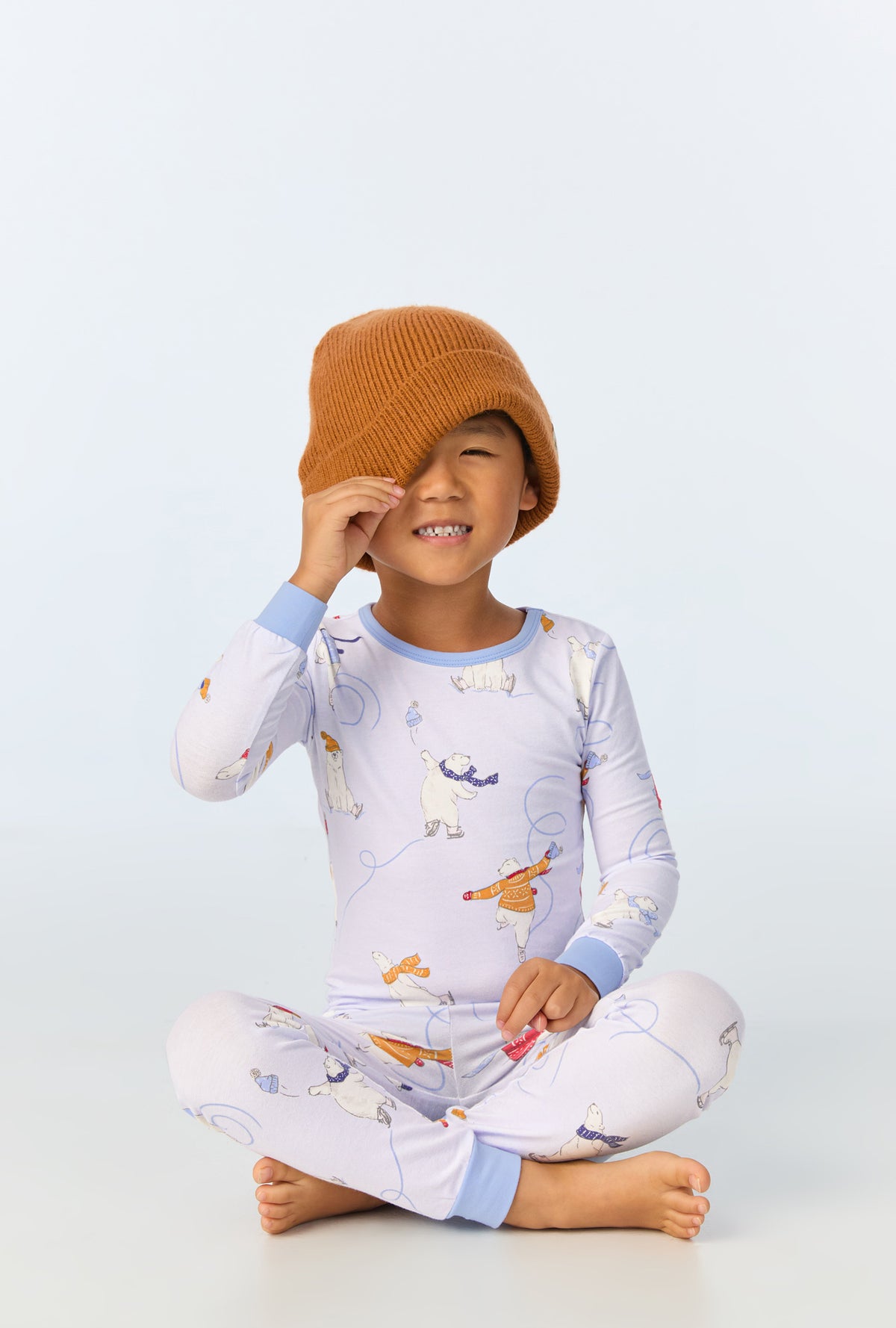 A child wearing Free Skate Long Sleeve Stretch Jersey Kids PJ Set