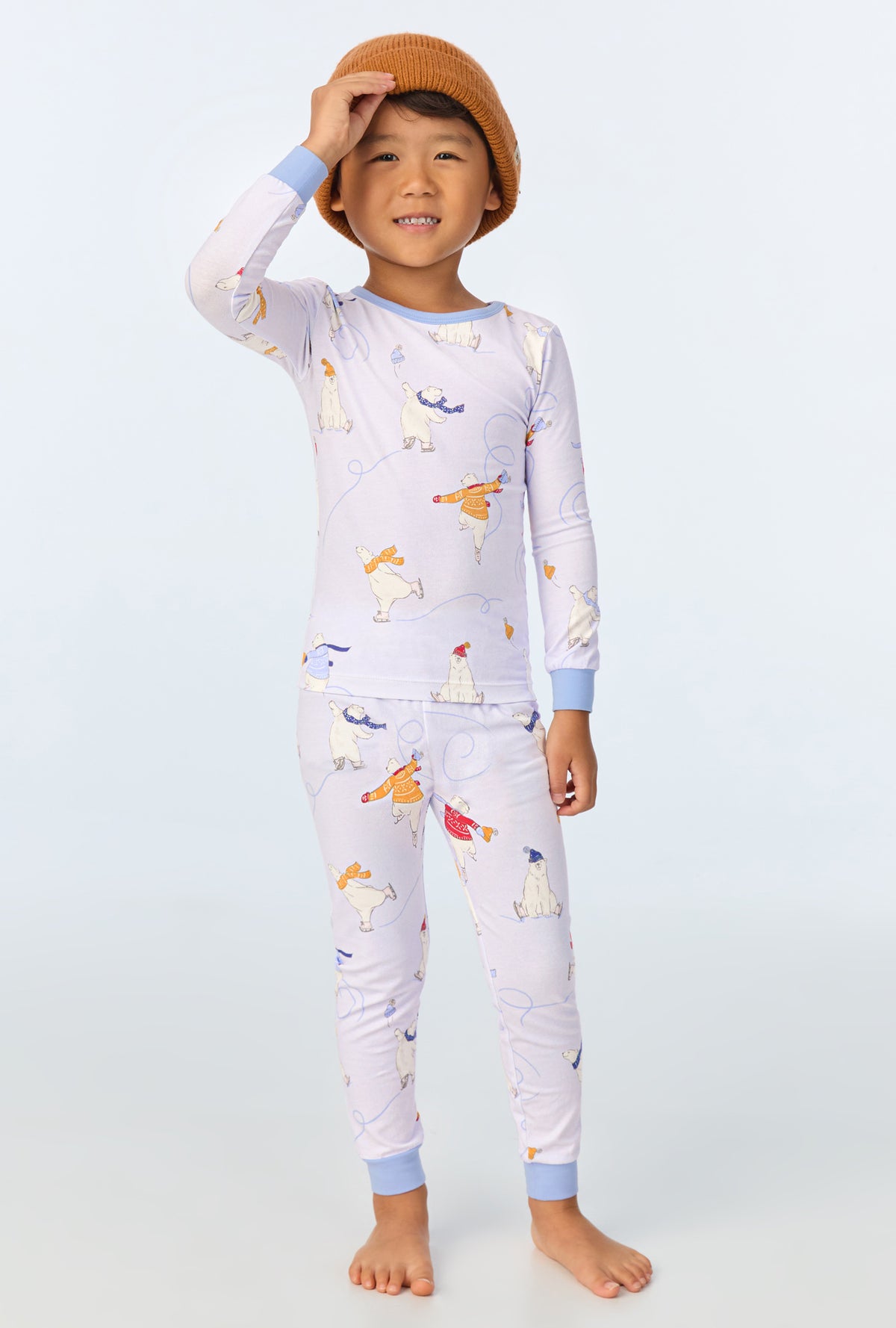 A child wearing Free Skate Long Sleeve Stretch Jersey Kids PJ Set