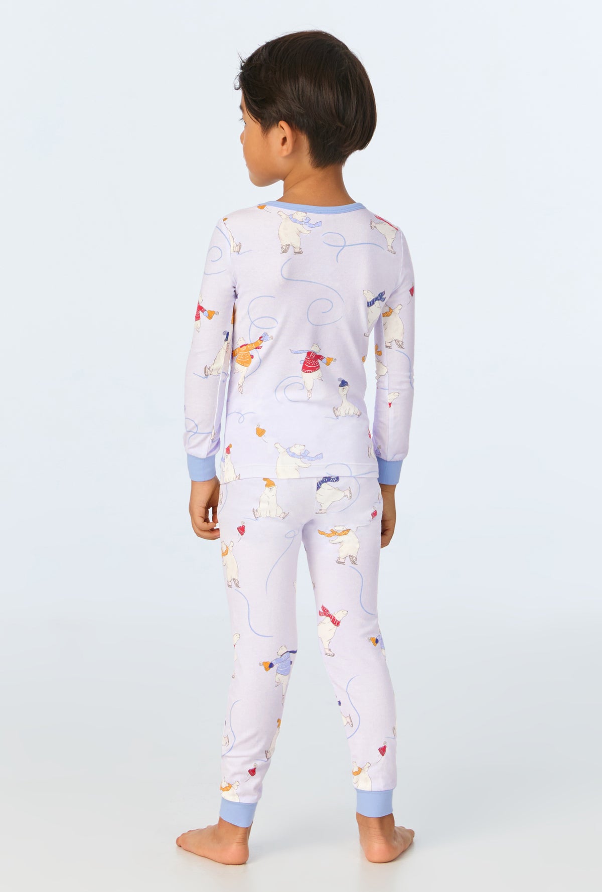 A child wearing Free Skate Long Sleeve Stretch Jersey Kids PJ Set