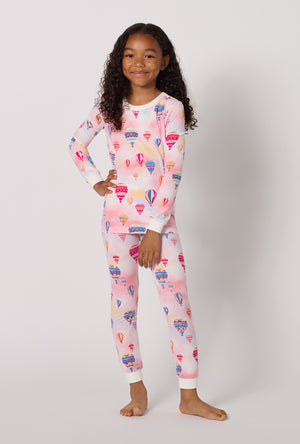 A Girl Wearing Serene Sunrise Long Sleeve Stretch Jersey Kids Pj Set