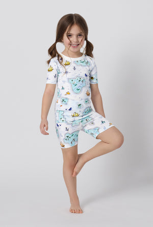 A little girl wearing Treasure Hunt Short Sleeve Stretch Jersey Kids Short Pj Set