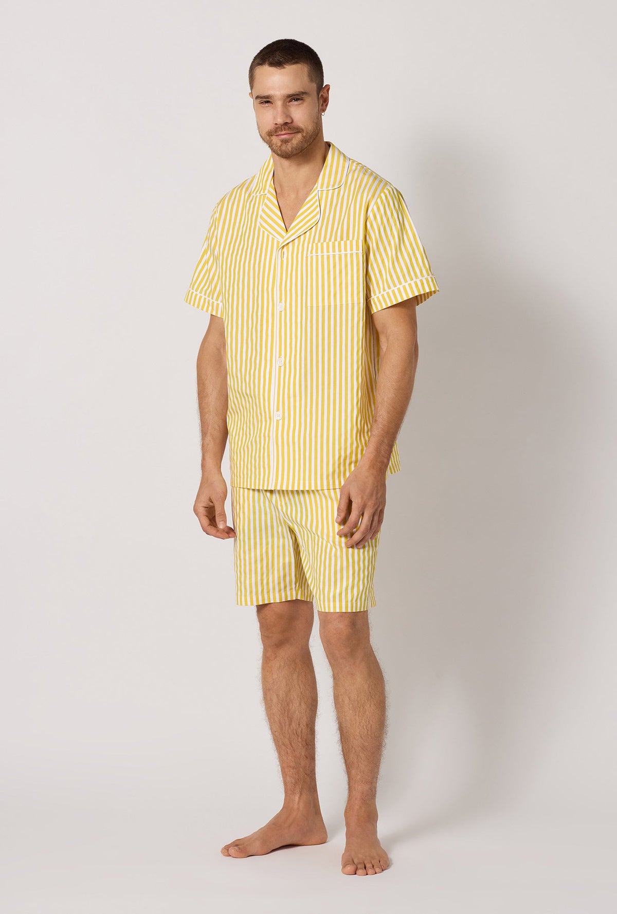 A man wearing Yellow Men's Short Sleeve Notch Woven Cotton Sateen Boxer Pj Set side view