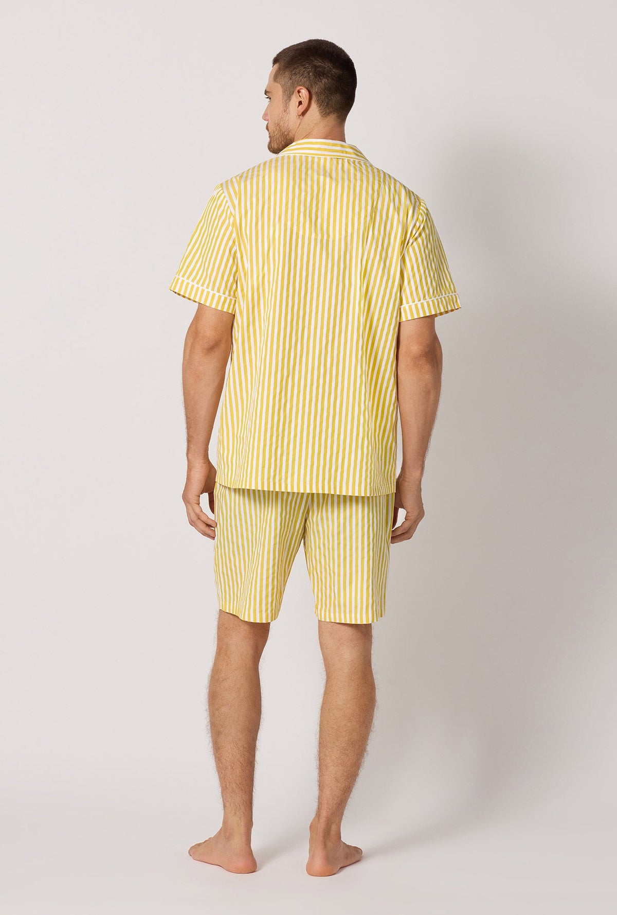A man wearing Yellow Men's Short Sleeve Notch Woven Cotton Sateen Boxer Pj Set back view