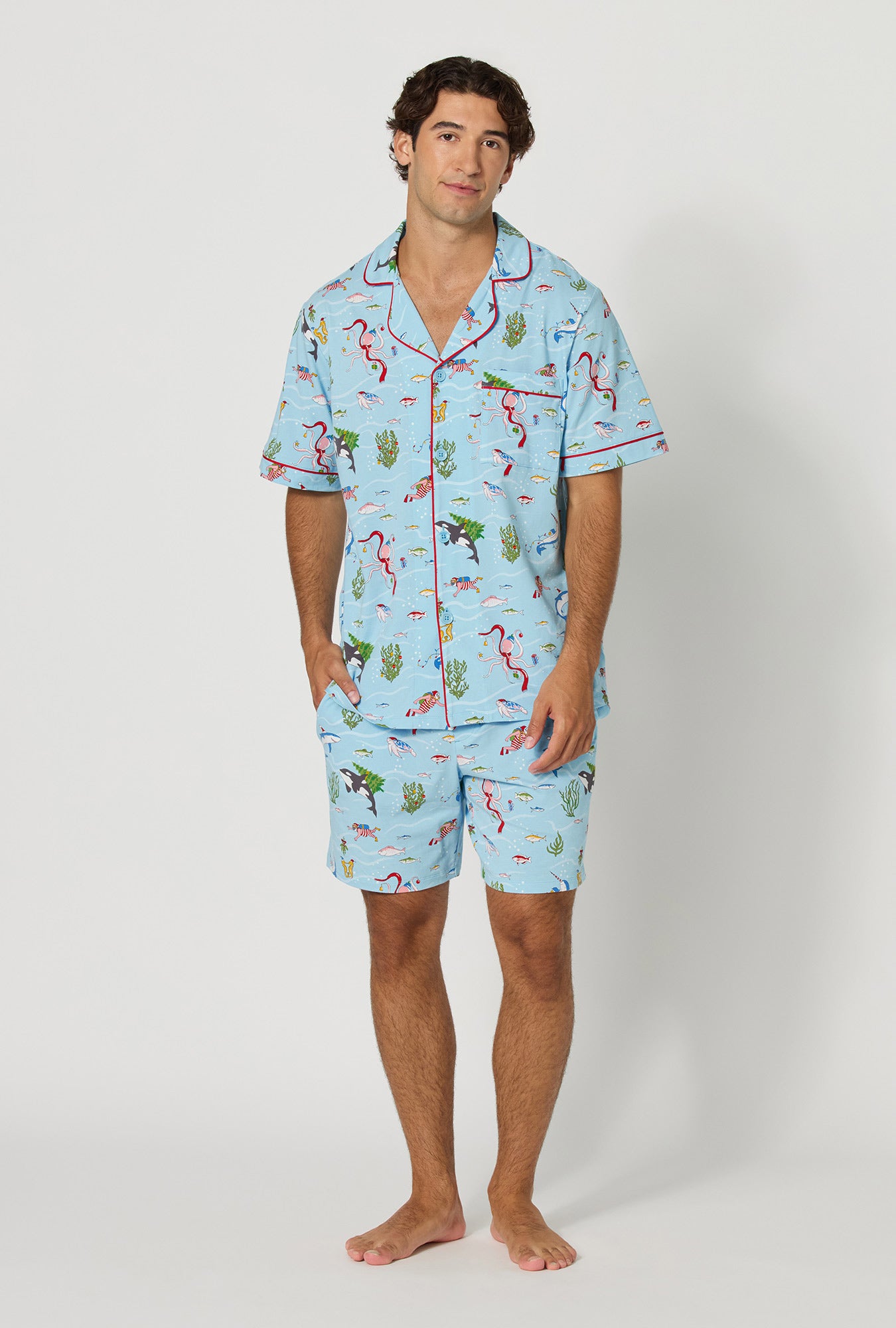 A man wearing Jingle All The Wave Men's Short Sleeve Classic Stretch Jersey Short Pj Set