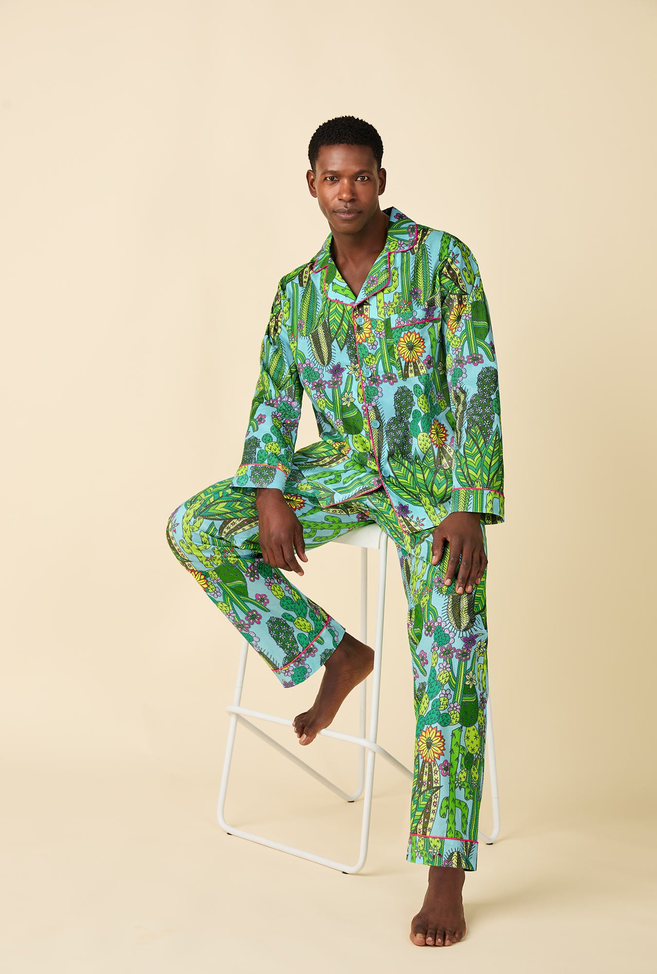 A man wearing BedHead x Mr. Turk Cactus Men's Long Sleeve Classic Woven Cotton Poplin PJ Set