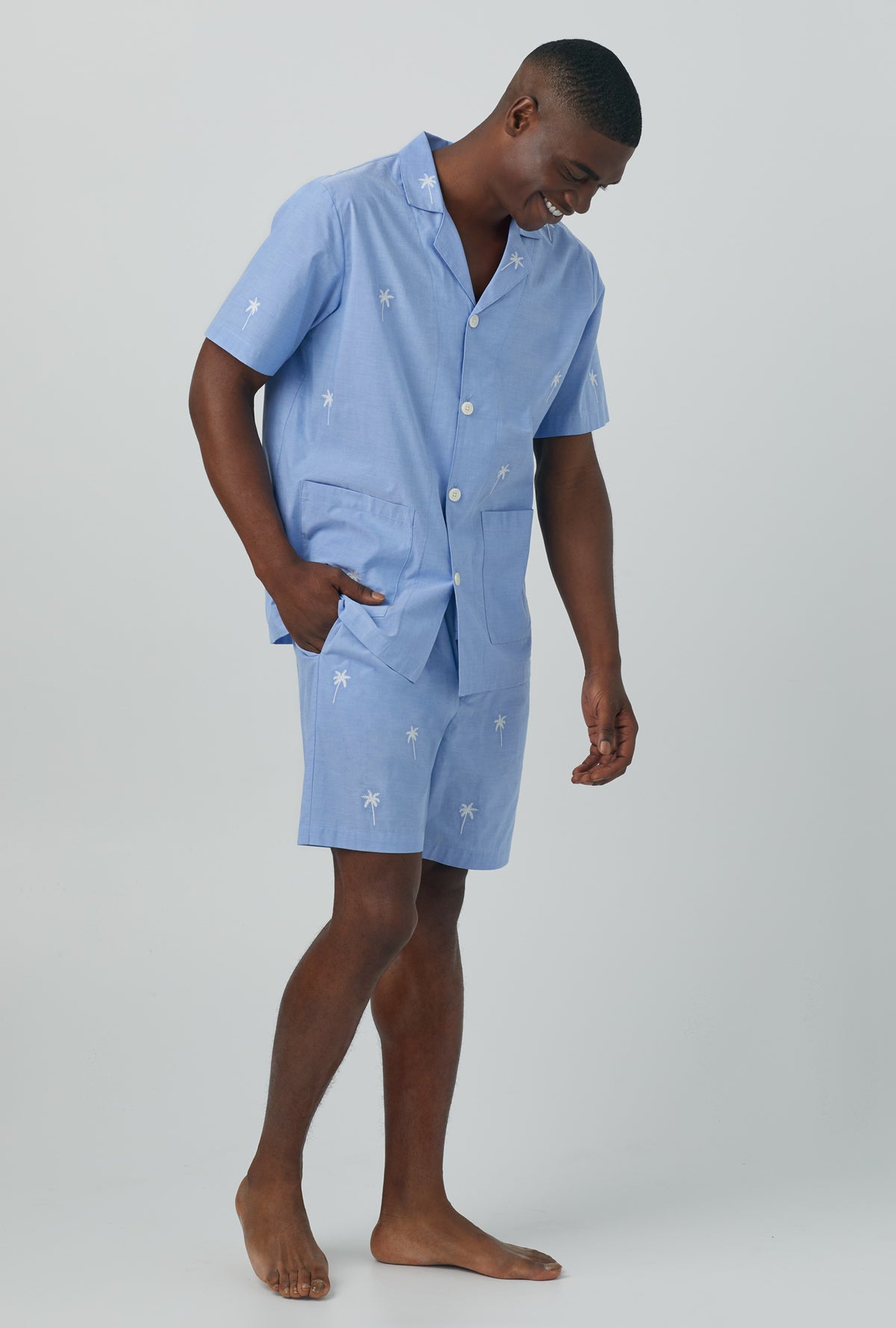 A man wearing blue Woven Cotton Poplin Boxer PJ Set with Chambray print