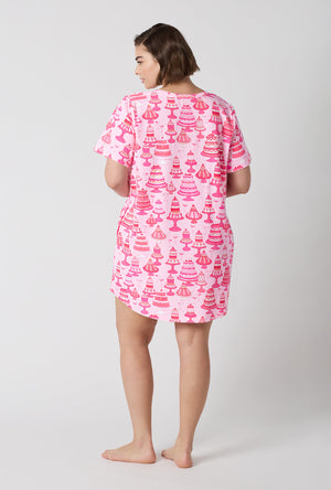 A Lady Wearing Plus Size Cake Shop Stretch Jersey T-shirt Sleep Dress in a back view standing pose