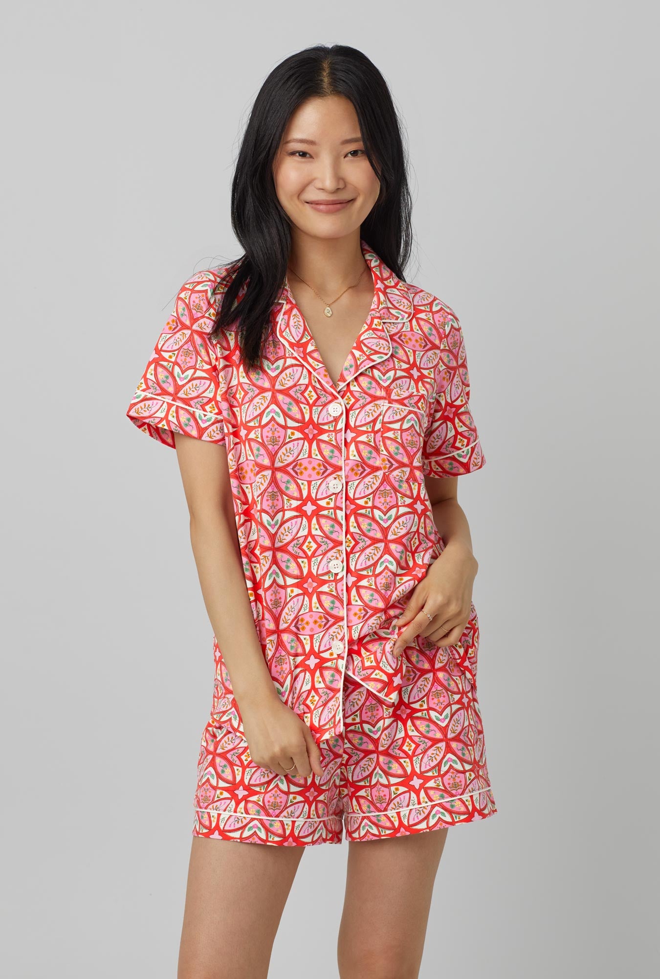 A lady wearing red Short Sleeve Classic Short Set Stretch Jersey PJ Set with Prairie Dawn print