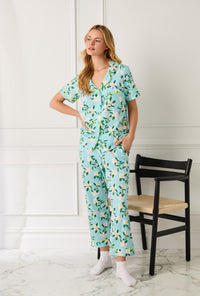 A Lady Wearing Short Sleeve Classic Stretch Jersey Cropped PJ Set with Belle Blossoms Print