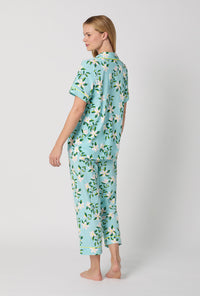 A Lady Wearing Short Sleeve Classic Stretch Jersey Cropped PJ Set with Belle Blossoms Print Side Angle Back View