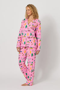 A lady wearing Holiday On Fifth Long Sleeve Classic Stretch Jersey Pj Set looking side