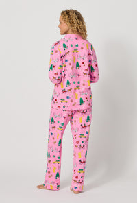 A lady wearing Holiday On Fifth Long Sleeve Classic Stretch Jersey Pj Set back vew