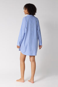 A Lady Wearing French Stripe High Low Woven Supersoft Cotton Poplin Boyfriend Shirt in a back view pose