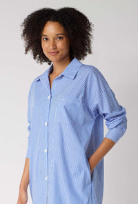 A Lady Wearing French Stripe High Low Woven Supersoft Cotton Poplin Boyfriend Shirt in a side close up view pose