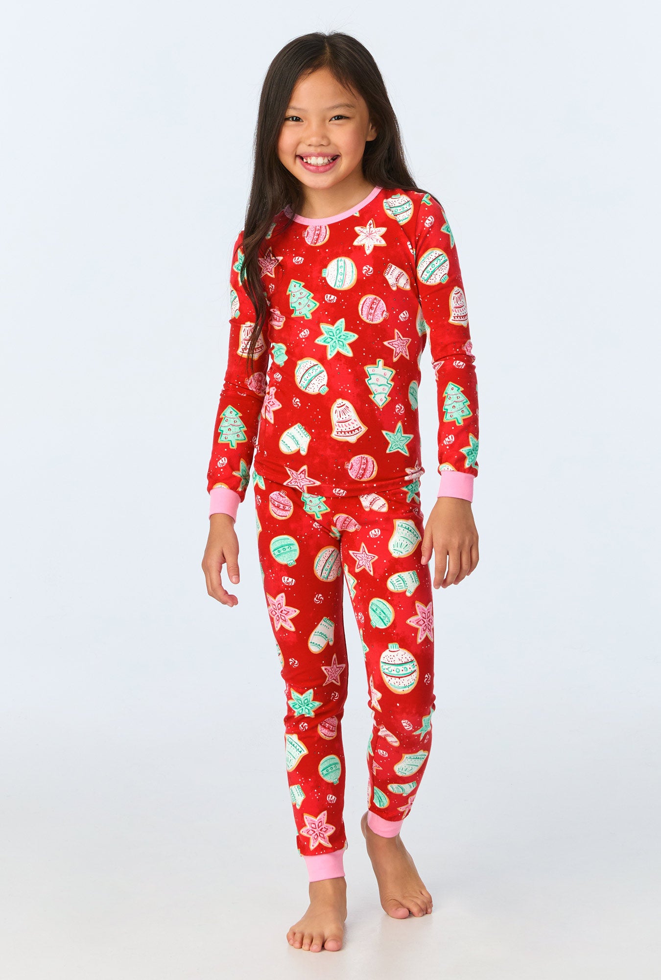 A child wearing Sugar Cookies Long Sleeve Stretch Jersey Kids PJ Set