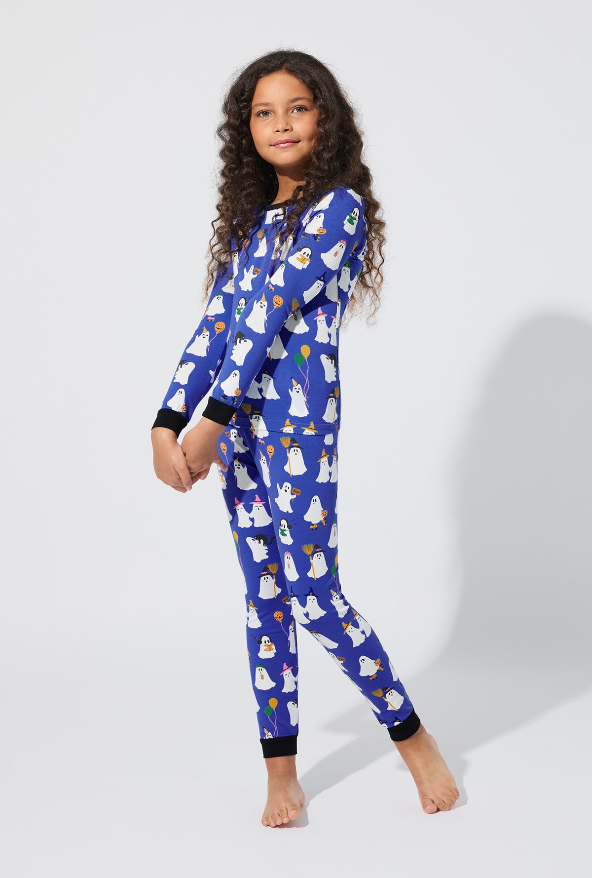A girl wearing That’s The Spirit Long Sleeve Stretch Jersey Kids PJ Set