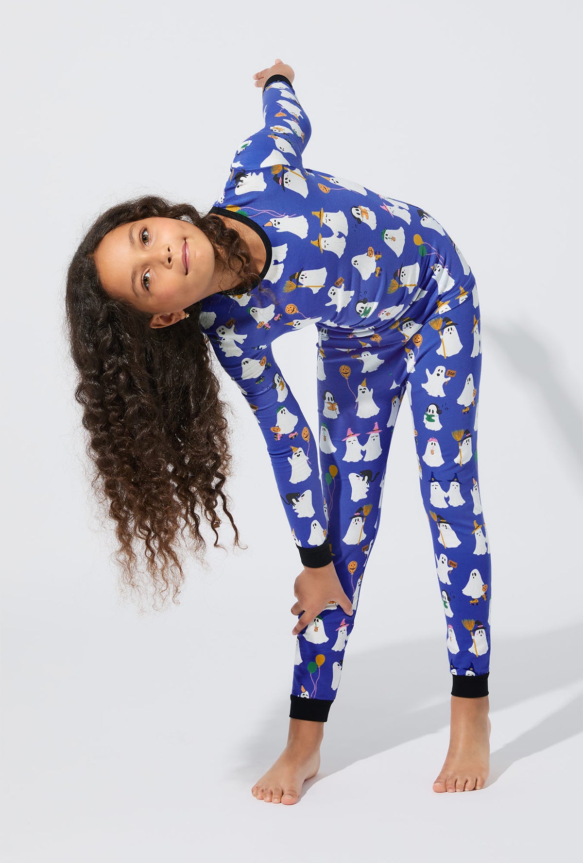A girl wearing That’s The Spirit Long Sleeve Stretch Jersey Kids PJ Set