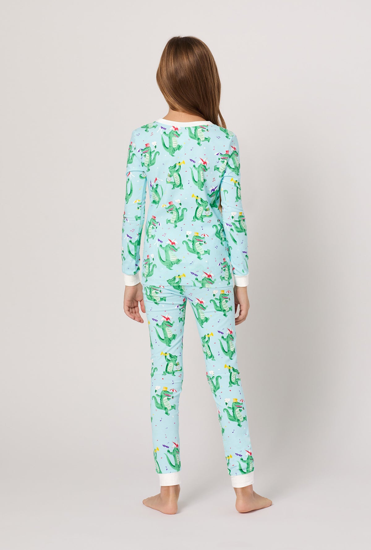 A girl wearing Jazzy Gators Long Sleeve Stretch Jersey Kids Pj Set