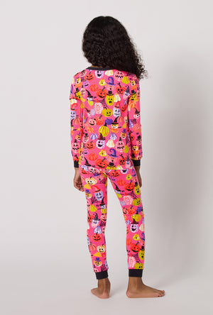 A Girl Wearing Pumpkin Patch Party Long Sleeve Stretch Jersey Kids Pj Set in a back view pose