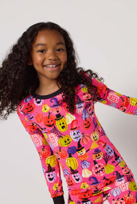 A Girl Wearing Pumpkin Patch Party Long Sleeve Stretch Jersey Kids Pj Set in a close up view pose
