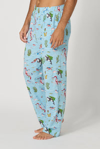 A man wearing Jingle All The Wave Men's Stretch Jersey Pj Pant side view
