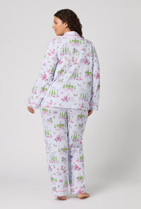 A Lady Wearing Plus Size Belle Vie Long Sleeve Classic Stretch Jersey Pj Set in a back view pose