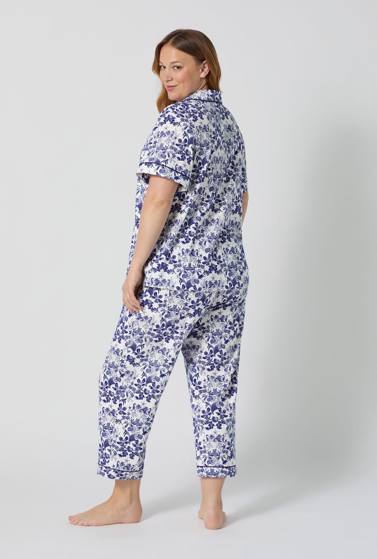 A lady wearing plus size Under The Sea Short Sleeve Classic Stretch Jersey Cropped Pj Set back view