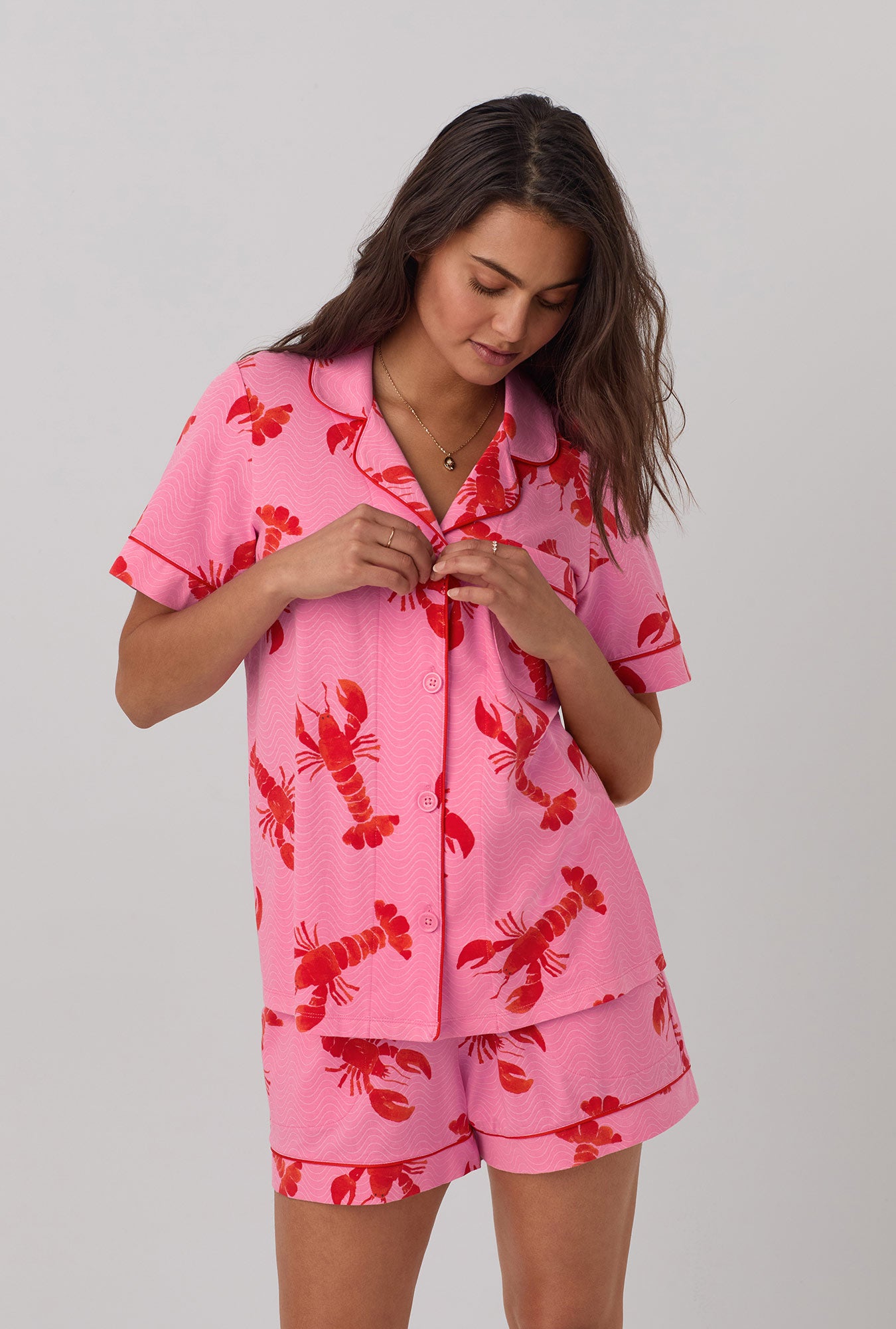 A lady wearing  pink  Short Sleeve Classic Shorty Stretch Jersey PJ Set with Lobster Fest print.