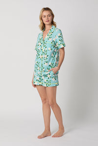 A Lady Wearing Short Sleeve Classic Shorty Stretch Jersey PJ Set with Belle Blossoms Print Side Angle View