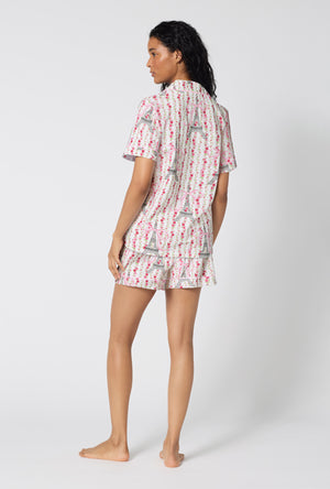 A Lady Wearing Fleur De La Tour Short Sleeve Classic Shorty Stretch Jersey Pj Set in a back view pose